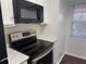 Bright kitchen featuring stainless steel appliances, granite countertops, and updated cabinets at 2727 W Oak Ridge Rd # 5-6, Orlando, FL 32809
