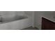 Clean bathroom features a white bathtub, perfect for relaxation and comfort at 2953 Sailhouse Dr, St Cloud, FL 34771