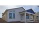 Charming one-story home featuring large windows and a welcoming front porch at 2953 Sailhouse Dr, St Cloud, FL 34771