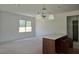 Kitchen with white walls, breakfast bar with white countertop, and modern lighting at 2953 Sailhouse Dr, St Cloud, FL 34771