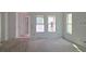 Bright living room featuring white walls and multiple windows for ample natural light at 2953 Sailhouse Dr, St Cloud, FL 34771