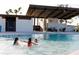 enjoying the community pool, with lounge seating and covered areas visible at 2953 Sailhouse Dr, St Cloud, FL 34771