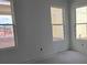 This room boasts three windows with views of the new neighborhood construction at 2953 Sailhouse Dr, St Cloud, FL 34771