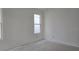 An open, unfinished room with lots of potential, featuring two windows to let the light in at 2953 Sailhouse Dr, St Cloud, FL 34771