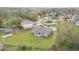 An elevated rear view of a one-story home with a lawn, set within a verdant, suburban neighborhood at 322 Dagama Ct, Kissimmee, FL 34758