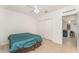 Bright bedroom featuring a closet and doorway through to the kitchen area at 322 Dagama Ct, Kissimmee, FL 34758