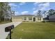 Inviting single-Gathering home showcasing lush front lawn and a clearly marked mailbox at 322 Dagama Ct, Kissimmee, FL 34758