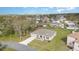 Single-story home with a long driveway and front-facing garage in a green, residential neighborhood at 322 Dagama Ct, Kissimmee, FL 34758