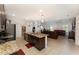 Spacious open-concept kitchen with granite counters, stainless appliances, and bar stool seating at 322 Dagama Ct, Kissimmee, FL 34758