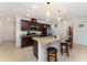 Bright kitchen with granite counters, stainless steel appliances, and large island with seating at 322 Dagama Ct, Kissimmee, FL 34758