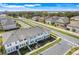 Aerial view of a neighborhood featuring modern townhomes and scenic landscaping at 3270 Water Sprite St, Orlando, FL 32808