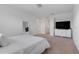 Bright bedroom features a window and TV at 3270 Water Sprite St, Orlando, FL 32808