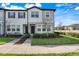Inviting townhouse exterior with well-maintained lawn and modern architectural details at 3270 Water Sprite St, Orlando, FL 32808