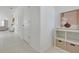Hallway with modern decor, tile flooring, and white trim at 3270 Water Sprite St, Orlando, FL 32808