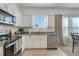 Modern kitchen features stainless steel appliances, granite countertops, and ample cabinet space at 3270 Water Sprite St, Orlando, FL 32808