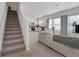 Open living area with stairs, kitchen, dining area and lots of natural light at 3270 Water Sprite St, Orlando, FL 32808