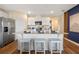 Well-equipped kitchen with white cabinets, stainless steel appliances, and a center island with seating at 3747 Bluethread Way, Poinciana, FL 34759
