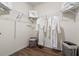 A well-organized walk-in closet offers ample storage with rods and shelves at 3747 Bluethread Way, Poinciana, FL 34759