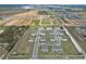 An aerial view of a well-planned neighborhood, showcasing modern townhomes and community layout at 421 Sedgewick Dr, Davenport, FL 33837