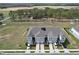Birds eye view of townhomes showing the properties and land at 421 Sedgewick Dr, Davenport, FL 33837