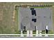 Aerial view of townhome with solar panels, private driveways and garages at 421 Sedgewick Dr, Davenport, FL 33837