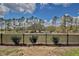 This image shows the backyard with a black metal fence in the daytime at 421 Sedgewick Dr, Davenport, FL 33837