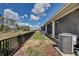 The exterior of a home is seen with a backyard and fence at 421 Sedgewick Dr, Davenport, FL 33837