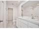 Well-lit bathroom featuring double sinks, a toilet, and a shower with tub at 421 Sedgewick Dr, Davenport, FL 33837