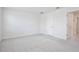 Neutral bedroom features soft carpet, white door, and easy access to en-suite at 421 Sedgewick Dr, Davenport, FL 33837