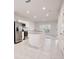 Modern kitchen featuring stainless steel appliances, white cabinets, granite countertops, and an island at 421 Sedgewick Dr, Davenport, FL 33837