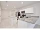 Open-concept kitchen with granite countertops, stainless steel appliances, and a center island at 421 Sedgewick Dr, Davenport, FL 33837