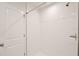 Bright, white tiled shower with a rainfall showerhead and modern fixtures at 421 Sedgewick Dr, Davenport, FL 33837