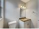 Bathroom with vanity, granite countertop, sink, mirror, and lighting at 4561 Evers Pl, Orlando, FL 32811