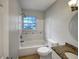 Clean bathroom with a tub/shower combo, toilet, and a vanity with countertop at 4561 Evers Pl, Orlando, FL 32811