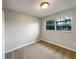 Neutral bedroom with carpet, window, and ample space for personalization at 4561 Evers Pl, Orlando, FL 32811