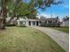 Charming single-story home with a well-manicured front yard and inviting curb appeal at 4561 Evers Pl, Orlando, FL 32811
