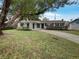 Charming single-story home with a well-manicured front yard and inviting curb appeal at 4561 Evers Pl, Orlando, FL 32811