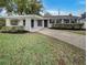 Lovely home with a landscaped front yard and covered entryway at 4561 Evers Pl, Orlando, FL 32811
