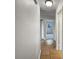 The hallway features neutral walls and a tiled floor leading to various rooms at 4561 Evers Pl, Orlando, FL 32811