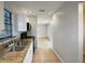 Functional kitchen with sleek countertops, stainless steel sink, and modern fixtures at 4561 Evers Pl, Orlando, FL 32811