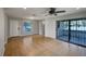 Bright living room with tile floors, ceiling fan, and sliding glass door to a porch at 4561 Evers Pl, Orlando, FL 32811