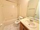 Neutral bathroom with a tub, shower, and sink with neutral tile floor at 4882 S Semoran Blvd # 1408, Orlando, FL 32822