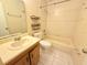 Neutral bathroom with a tub, shower, and sink with neutral tile floor at 4882 S Semoran Blvd # 1408, Orlando, FL 32822