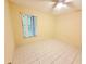 Bedroom featuring neutral walls and tile flooring with a window at 4882 S Semoran Blvd # 1408, Orlando, FL 32822