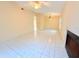 Spacious living room with tile flooring, fireplace, and view of the front of the property at 4882 S Semoran Blvd # 1408, Orlando, FL 32822