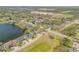 A lakeside neighborhood view with mature trees, well-maintained lawns, and beautiful surrounding scenery at 524 Quail View Ct, Debary, FL 32713