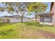 Expansive fenced backyard with mature trees and covered patio at 524 Quail View Ct, Debary, FL 32713