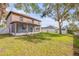 Lush green backyard and patio space, perfect for entertaining at 524 Quail View Ct, Debary, FL 32713