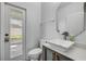 Bathroom featuring stylish vessel sink, modern fixtures and an exterior door at 524 Quail View Ct, Debary, FL 32713