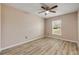 Bright bedroom showcasing beautiful wood floors and a ceiling fan, providing both comfort and style at 524 Quail View Ct, Debary, FL 32713